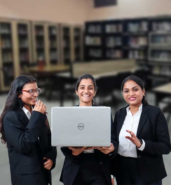 IMS Noida students reviewing the PGDM program overview on a laptop, exploring global career opportunities.